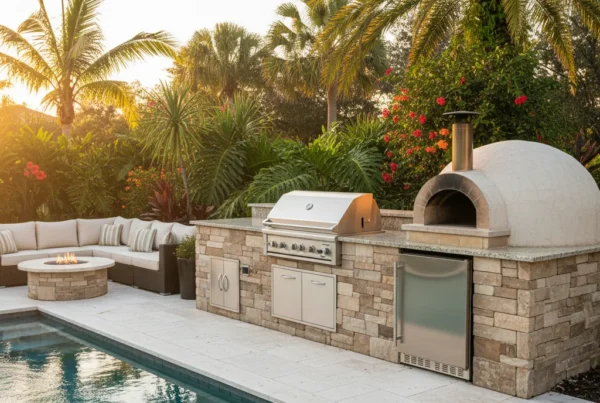 Central Florida outdoor kitchen with grill, refrigerator, and pool area